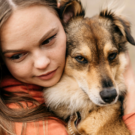 pretty-young-woman-petting-her-dog 2